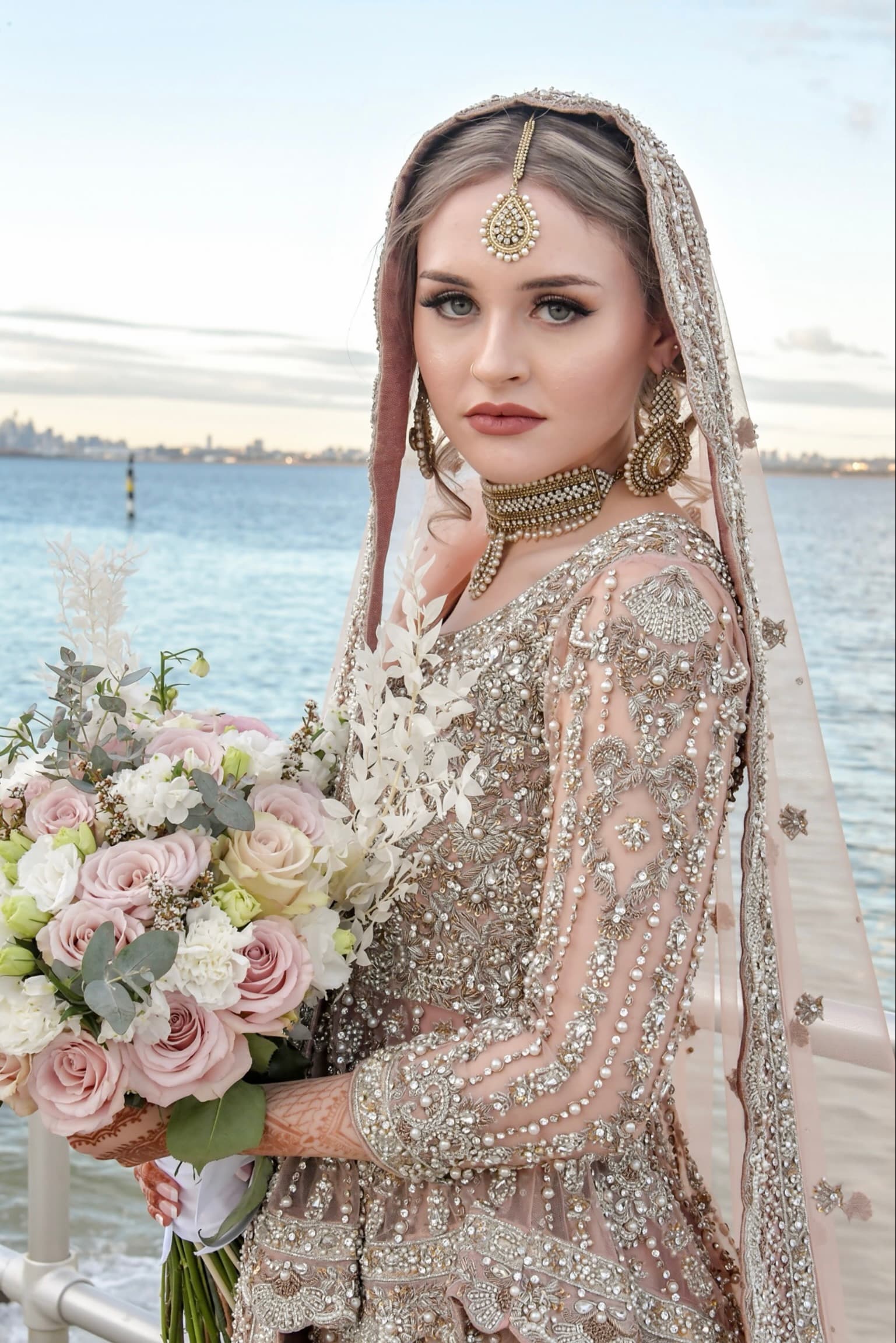 Bride in an ivory and pearl embellished outfit — soft glam walima makeup