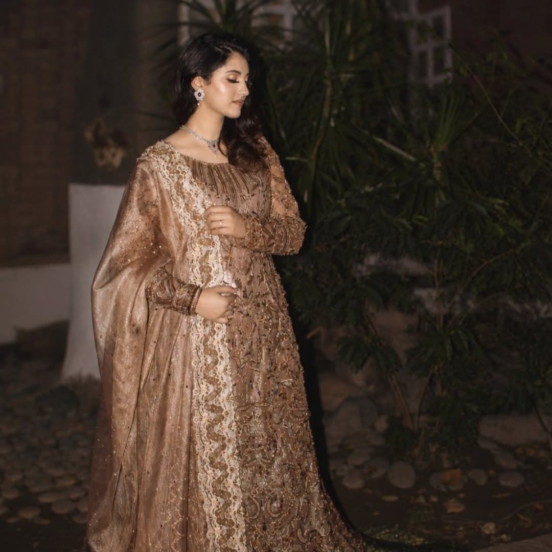 Bride in a champagne gown at dusk