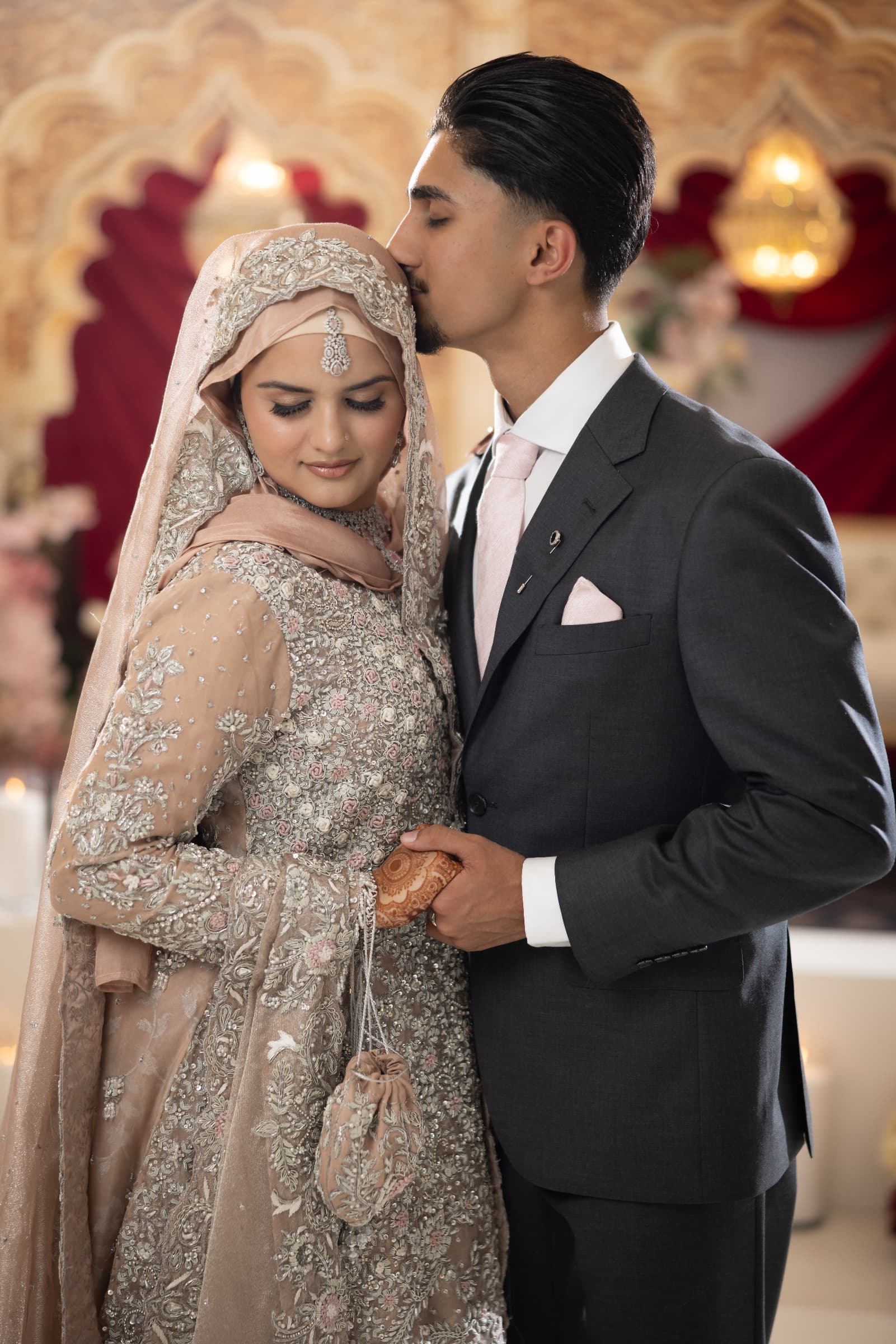 Hijab bride in a pink embellished outfit — soft glam walima makeup and hijab